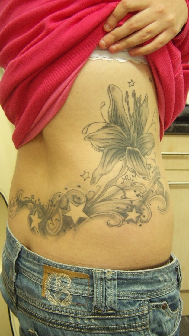 flower rib tattoos. Black Tattoo